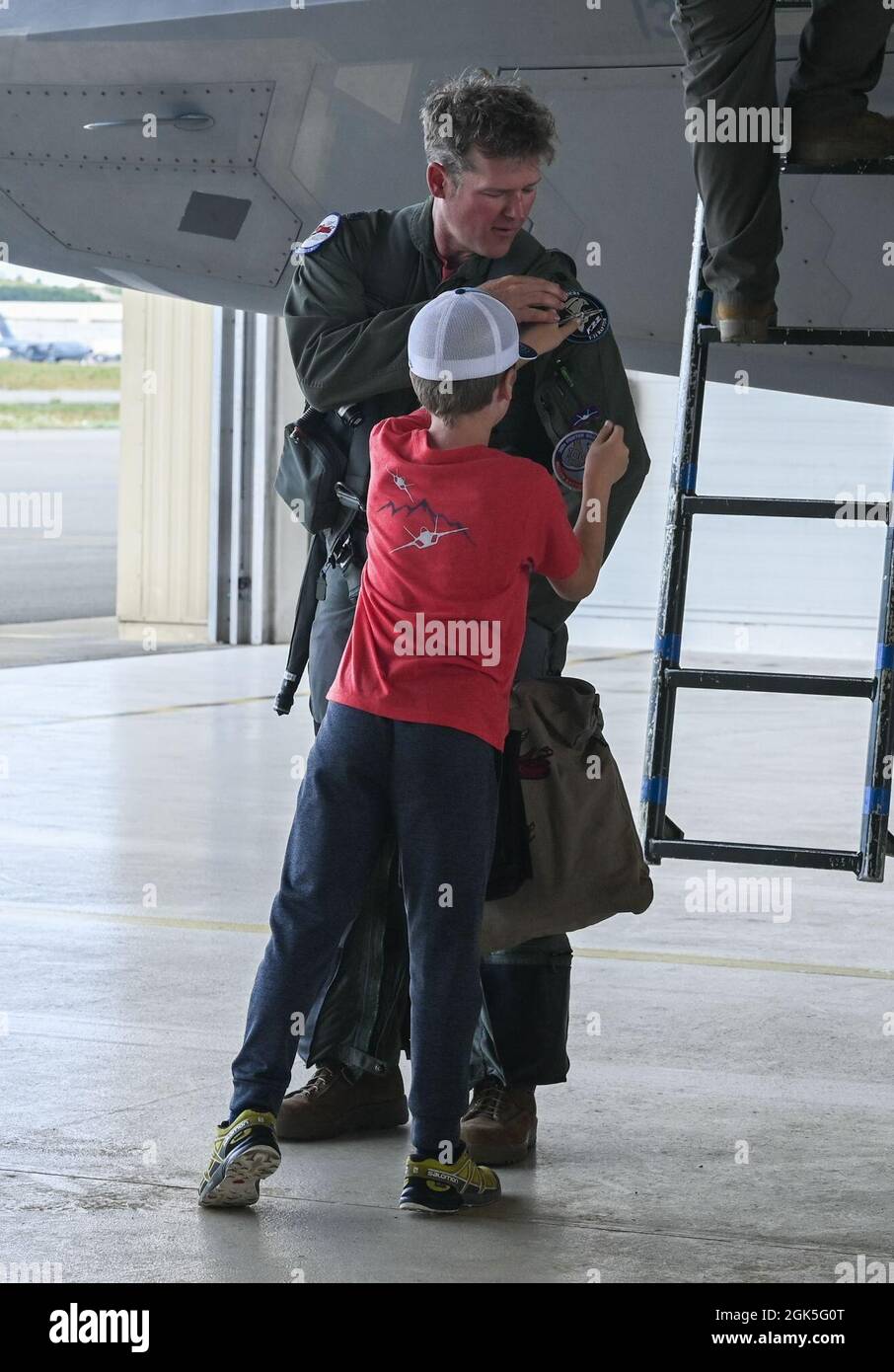 Lt Col Ryan Pelkola 302d Fighter Squadron Director Of Operations Receives A New Patch From His Son Aug 7 21 Joint Base Elmendorf Richardson Alaska Pelkola Is The First F 22 Raptor Pilot To