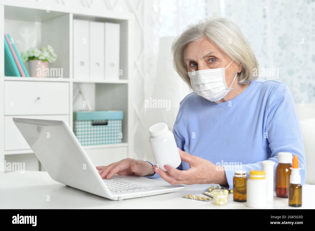 Mature woman wearing facial mask hi-res stock photography and images ...