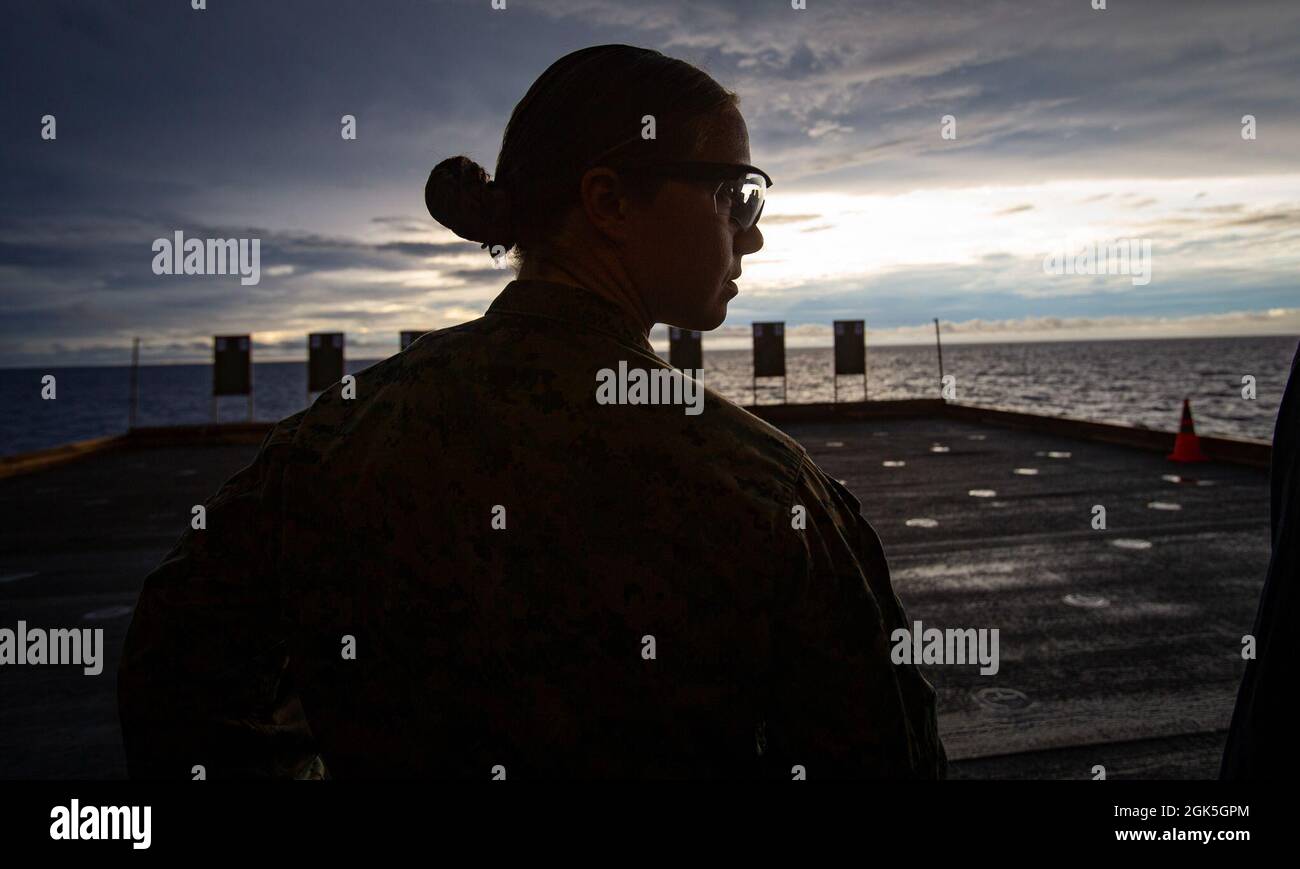 U.S. Marine Corps 1st Lt. Elizabeth Schilder, a material control officer  with 31st Marine Expeditionary Unit (MEU), waits for further instruction  during a shooting competition aboard amphibious assault ship USS America  (LHA