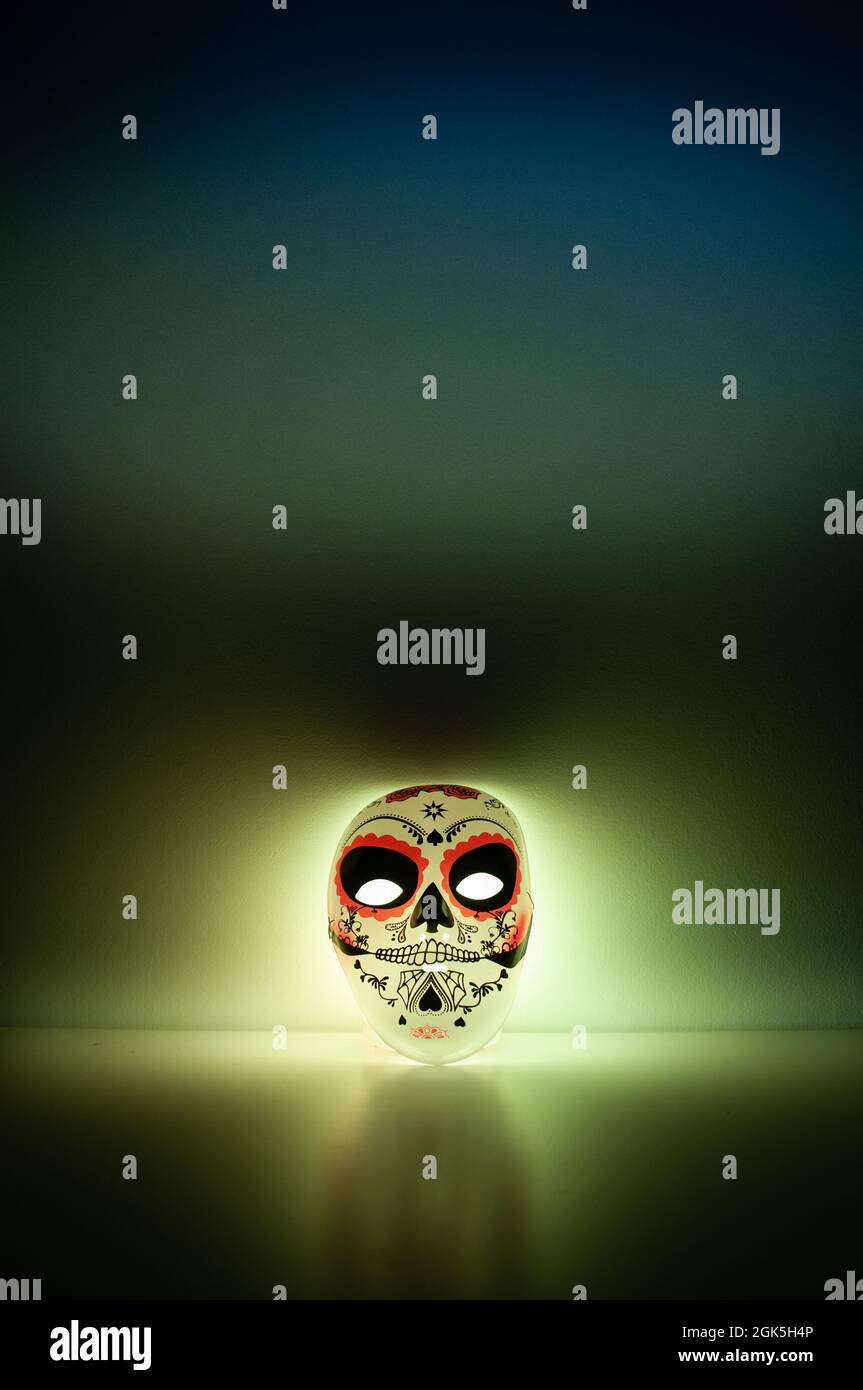 Mask of a halloween mask with back light on a dark background Stock ...