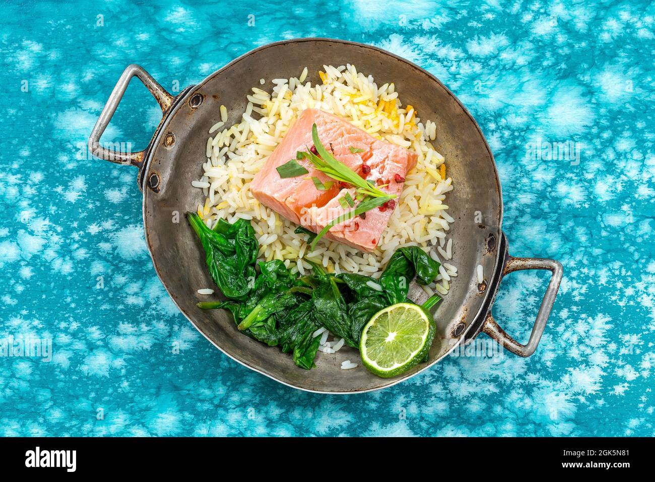 Boiled salmon with spinach, lemon and thyme. Stock Photo