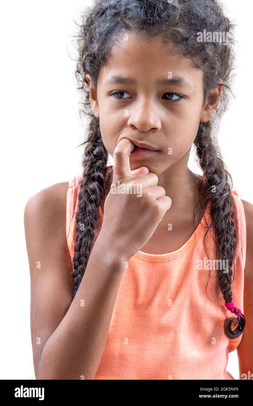 8-10 years old bites one's nail on white Stock Photo