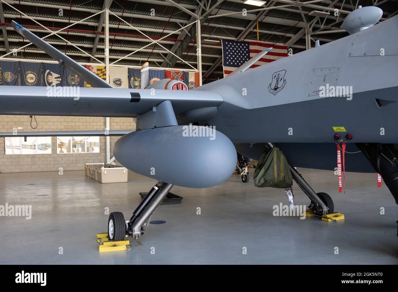 An extended range fuel tank is seen on an MQ9 Reaper remotely piloted