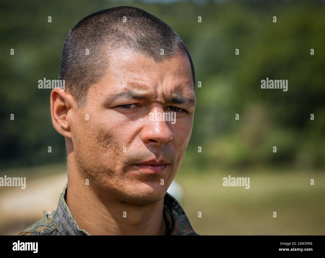 Dimitar Dimirev, A Bulgarian sniper looks out in the distance during the range estimation event of the European Best Sniper Team Competition, on Hohenfels, Germany, Aug. 10, 2021. The 2021 European Best Sniper Team Competition is a U.S. Army Europe and Africa-directed, 7th Army Training Command hosted contest of skill that includes 8 participating NATO allies and partner nations at 7th ATC’s Hohenfels Training Area, August 8-14. The European Best Sniper Team Competition is designed to improve professionalism and enhance esprit de corps. Stock Photo