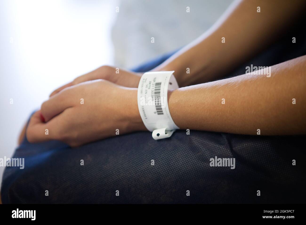 Patient on stretcher with medical identification bracelet in outpatient