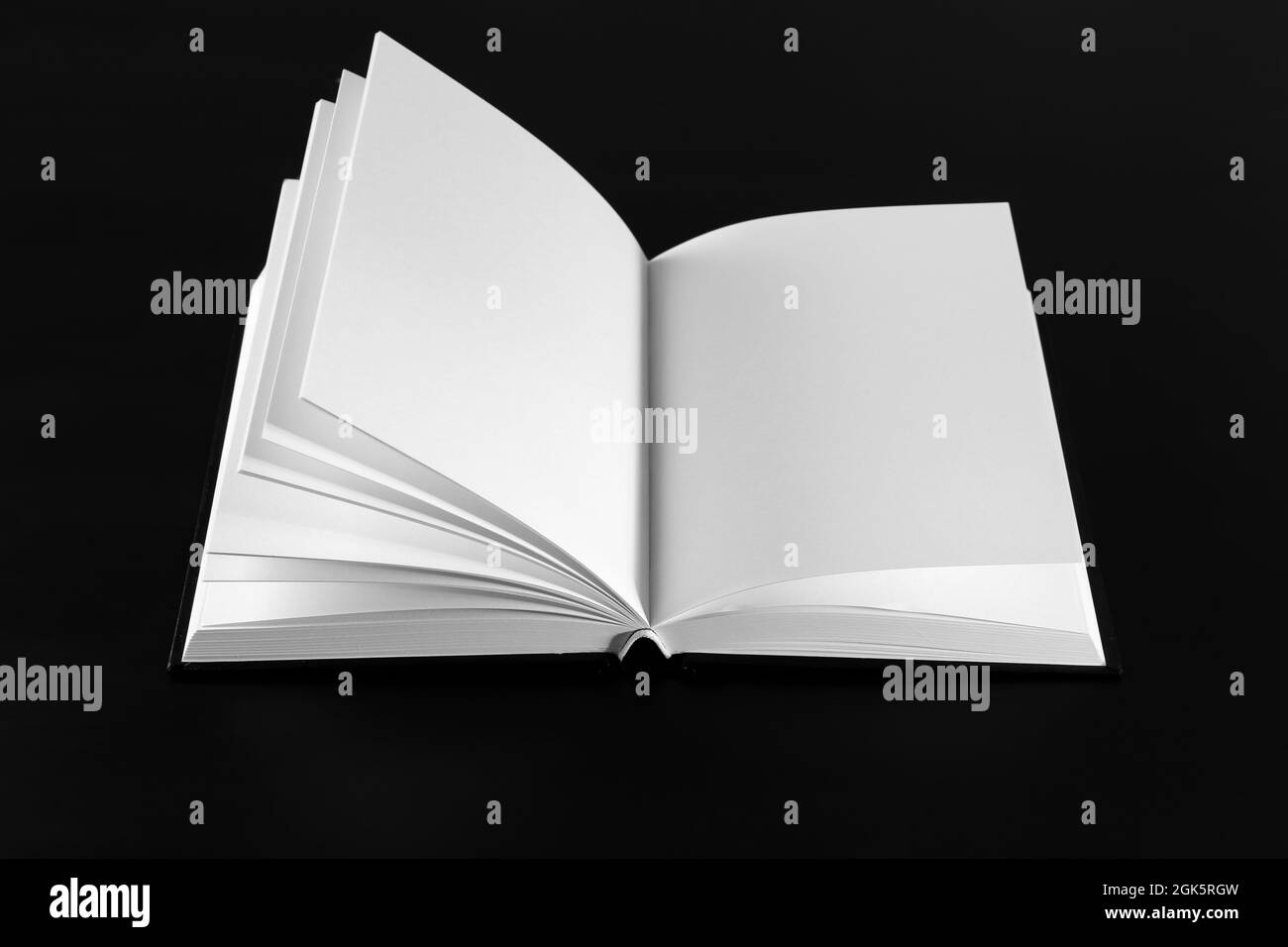 Open book with blank pages on black background Stock Photo Alamy