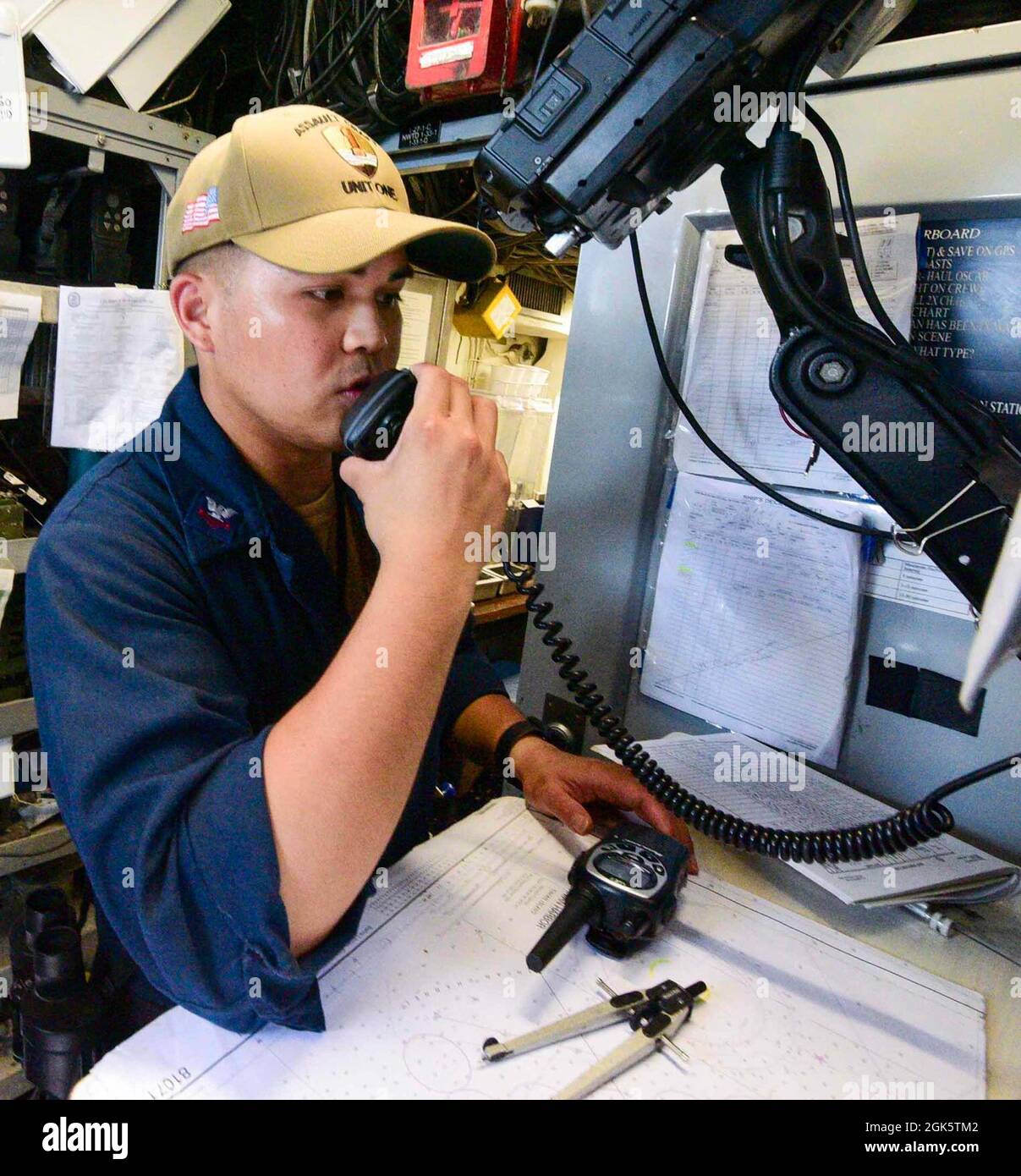 210810-N-MT581-1742    PACIFIC OCEAN (Aug. 10, 2021) Quartermaster 2nd Class Jaric Andaya, from San Diego, assigned to Assault Craft Unit (ACU) 1, contacts Tinian Port Operations from aboard a Landing Craft, Utility (LCU) carrying vehicles and supplies ashore during exercise Freedom Banner 2021, Aug. 10. Freedom Banner is an annual exercise that involves strategic projection of the Maritime Prepositioning Force (MPF) and associated combat forces. This year’s iteration supports Large Scale Exercise (LSE) 2021, which is designed to refine how we synchronize maritime operation across multiple Fle Stock Photo