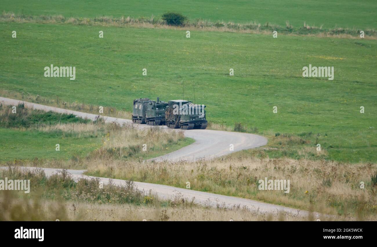 a pair of British army Hagglands Bandvagn 206 Bv206 in action on a military exercise Wiltshire UK Stock Photo