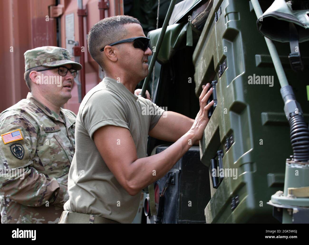 Capt. Hector Murray, an officer in charge of supply for the 410th Hospital  Center, right, and Sgt. 1st Class, Matthew Murray, a human resources  specialist from the 410th Hospital Center, spent their