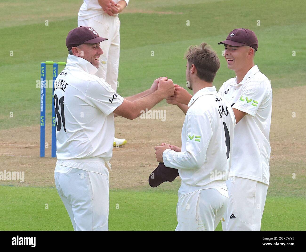 London, UK. 13th Sep, 2021. Surrey's Rikki Clarke and James Taylor share a moment with Will Jacks as Surrey take on Essex in the County Championship at the Kia Oval, day two. Credit: David Rowe/Alamy Live News Stock Photo