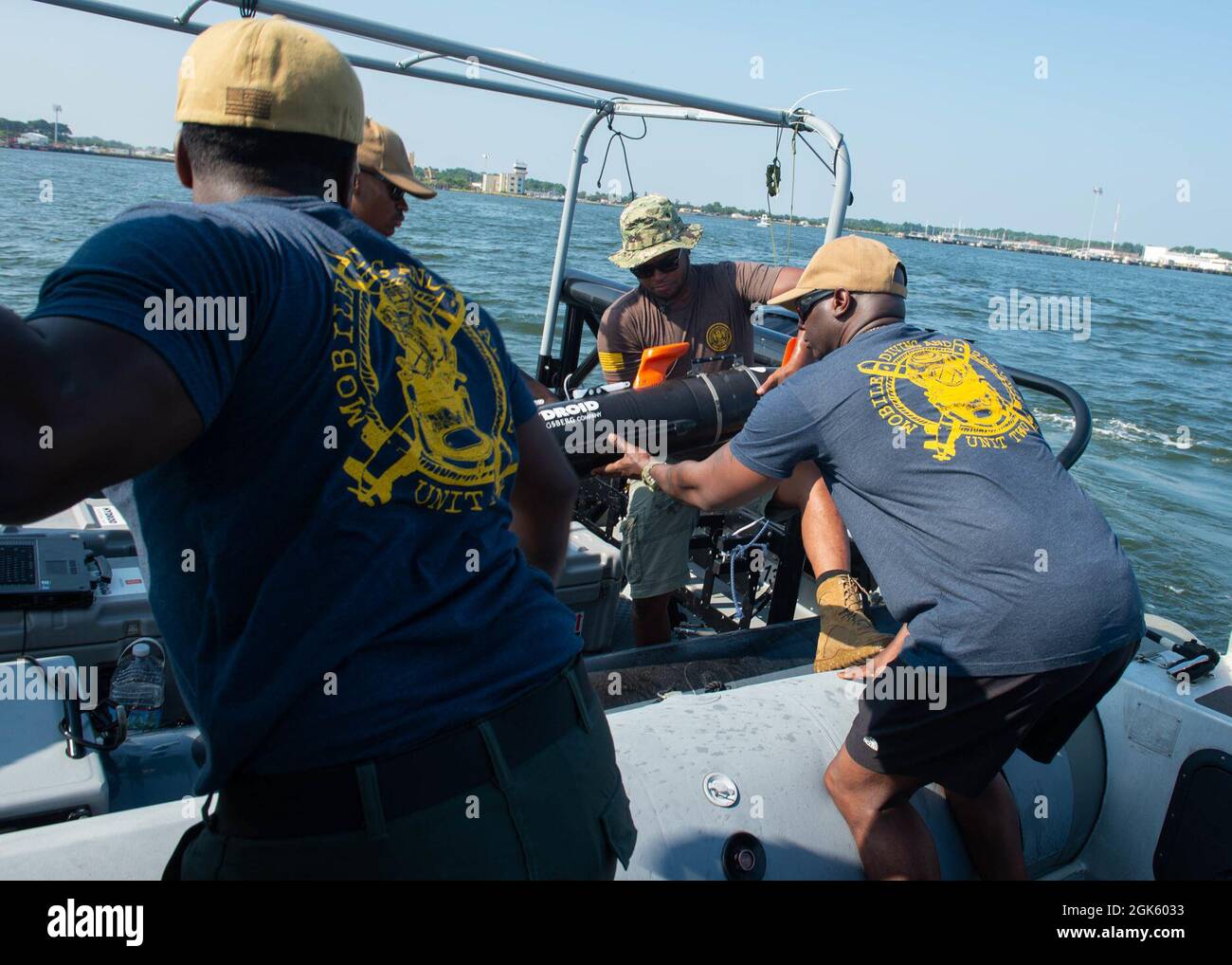 VIRGINIA BEACH, Va. (Aug. 12, 2021) – Sailors assigned to Mobile Diving and Salvage Unit 2 area search platoon prepare to scan a harbor bottom with a Mk 18 Mod 1 unmanned undersea vehicle for unexploded ordnance and other potential hazards during a port damage repair drill as part of Large-Scale Exercise (LSE) 2021 at Joint Expeditionary Base Little Creek-Fort Story. LSE 2021 merges live and synthetic training capabilities to create an intense, robust training environment. It will connect high-fidelity training and real-world operations to build knowledge and skills needed in today’s complex, Stock Photo