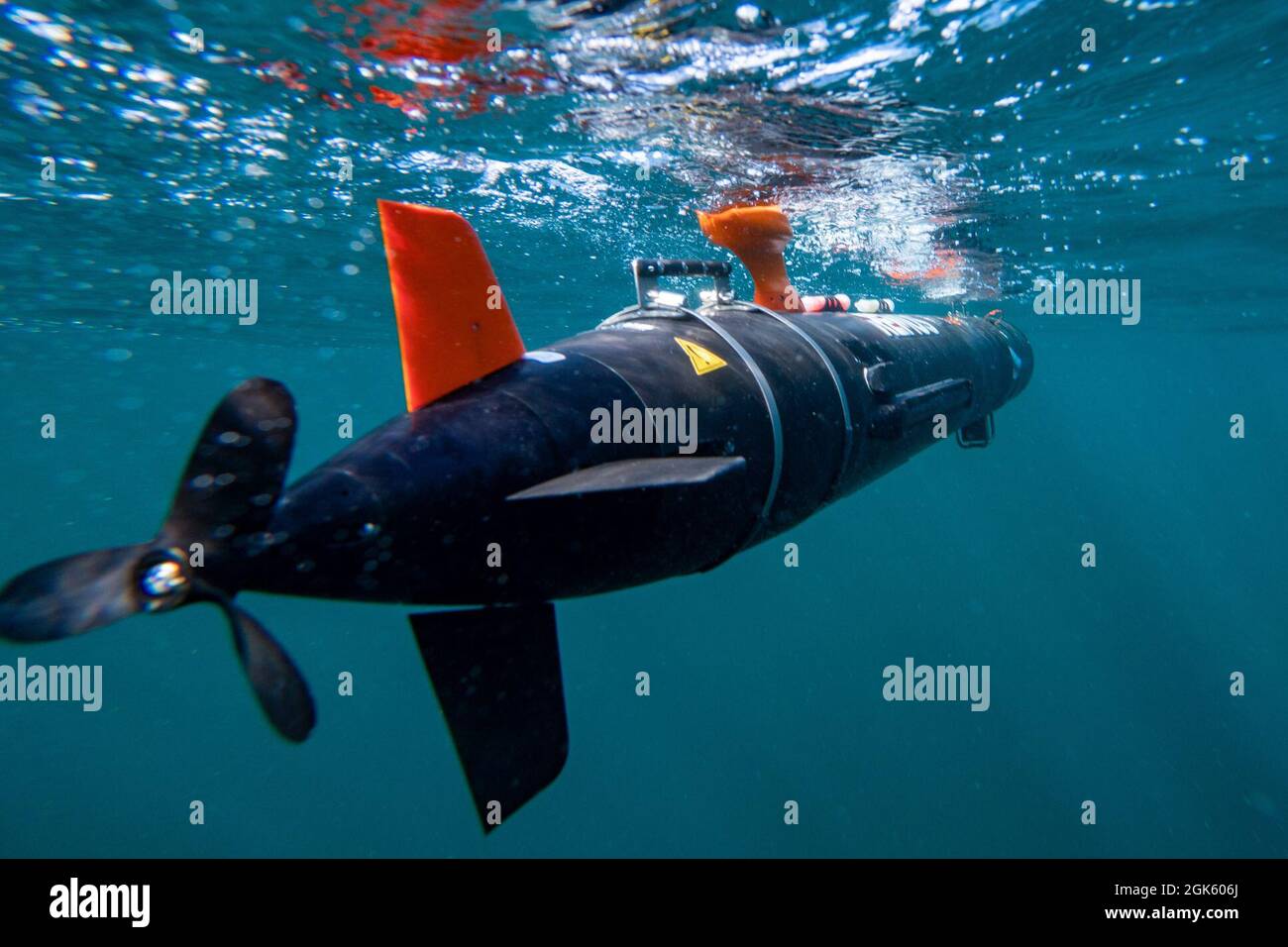 Navy Divers, assigned to Mobile Diving Salvage Unit (MDSU) 2, deploy a MK-18 Mod 1 unmanned underwater vehicle Stock Photo