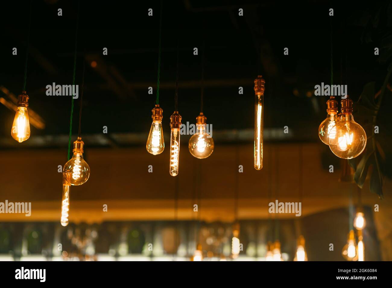 Various beautiful glowing glass lamps hang in the restaurant and serve