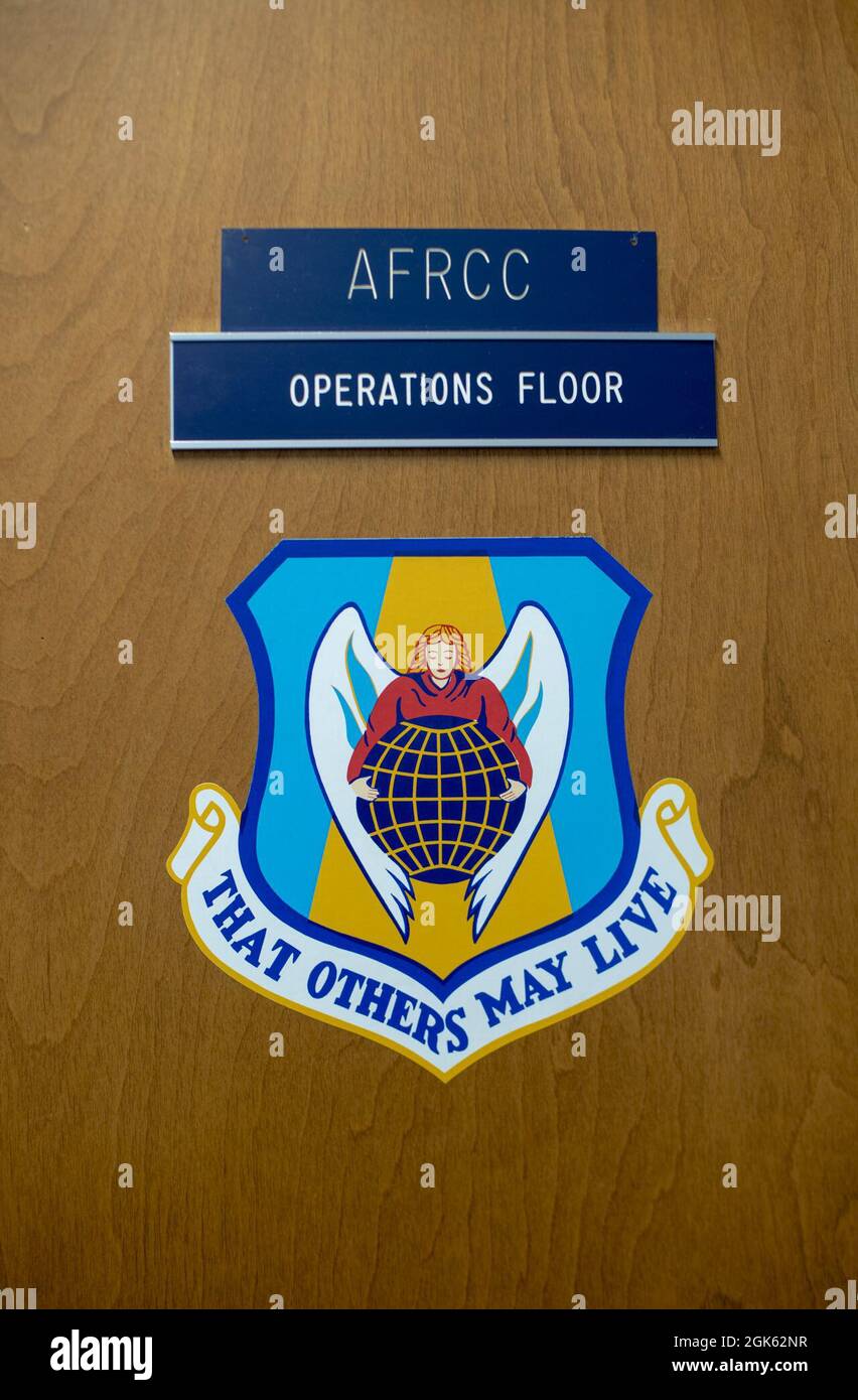 The Air Force rescue community’s motto “That Others May Live” is displayed on the door of the Air Force Rescue Coordination Center’s operations floor at Tyndall Air Force Base, Florida, Aug. 11, 2021. The AFRCC assisted with 762 rescue missions and 349 saves in 2020. Stock Photo