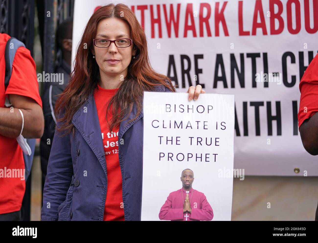 Supporters outside Inner London Crown Court, where Climate Wiseman, 46, is charged with fraud and unfair trading offences over the selling of 'plague protection kits' with claims a mixture made from oil and red string, was a cure for Covid-19. Picture date: Monday September 13, 2021. Stock Photo