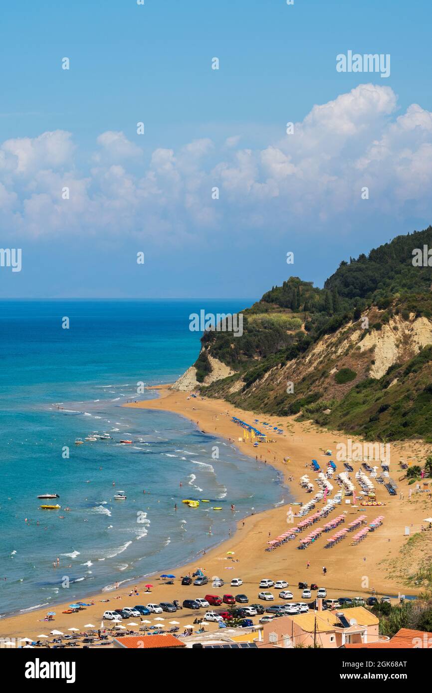 Picture postcard images of Agios Stefanos in Corfu incorporating sunny seascape view containing sea beaches rocks tourists tourism travel and holidays Stock Photo