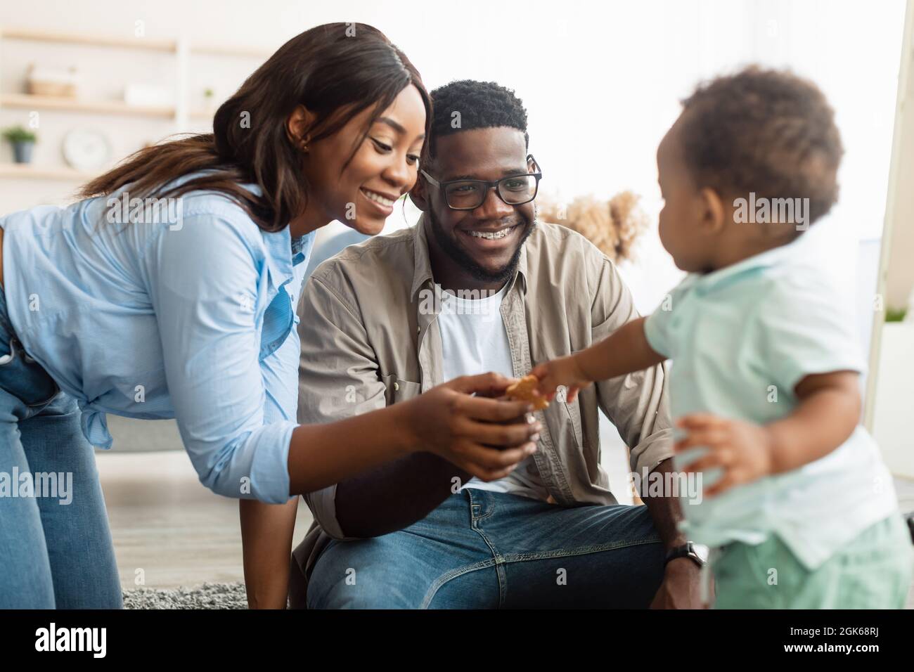 Portrait of happy black family smiling playing at home Stock Photo - Alamy