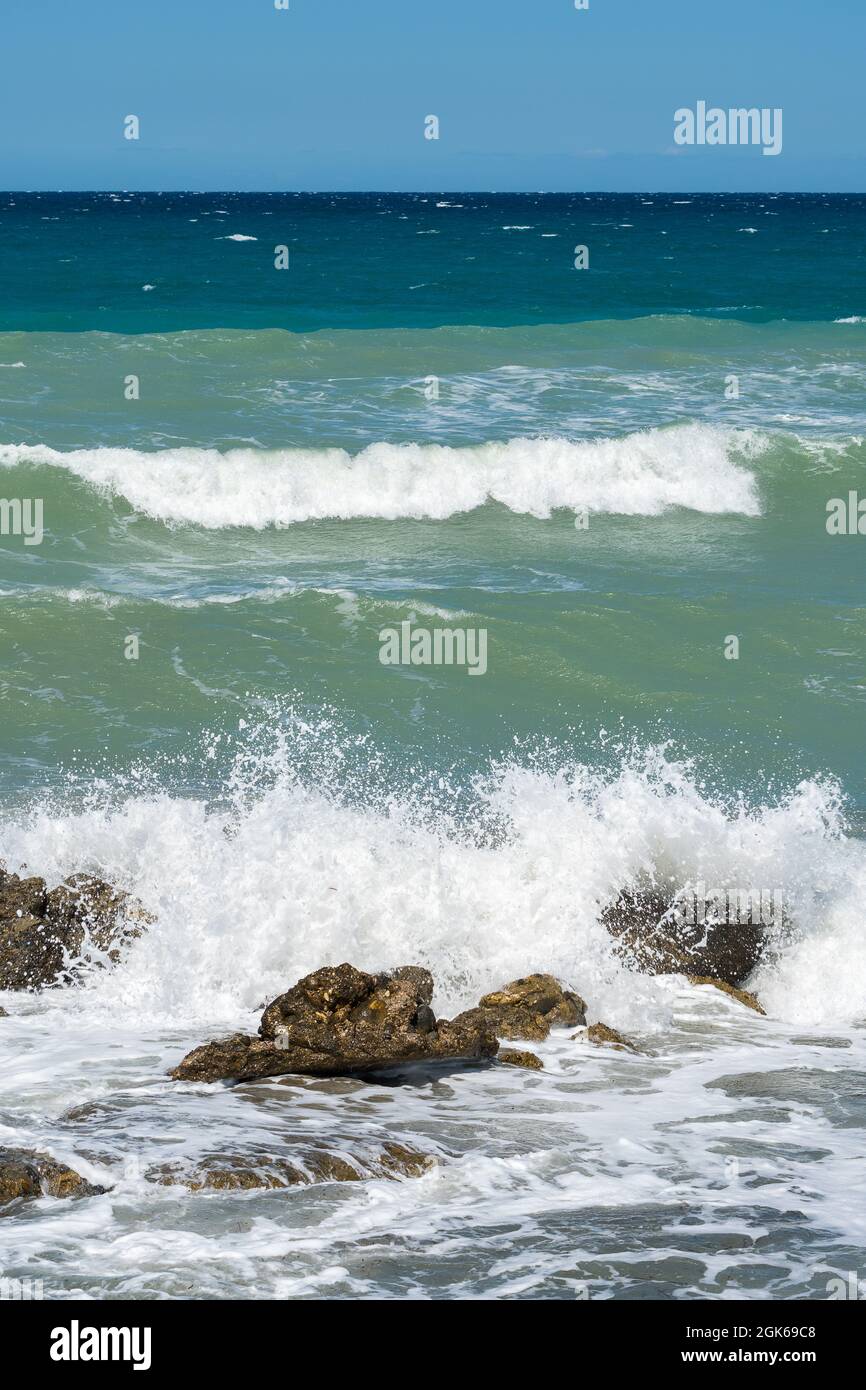Coastal views of crashing waves rugged rocks tidal surges sea swells lapping waves Stock Photo