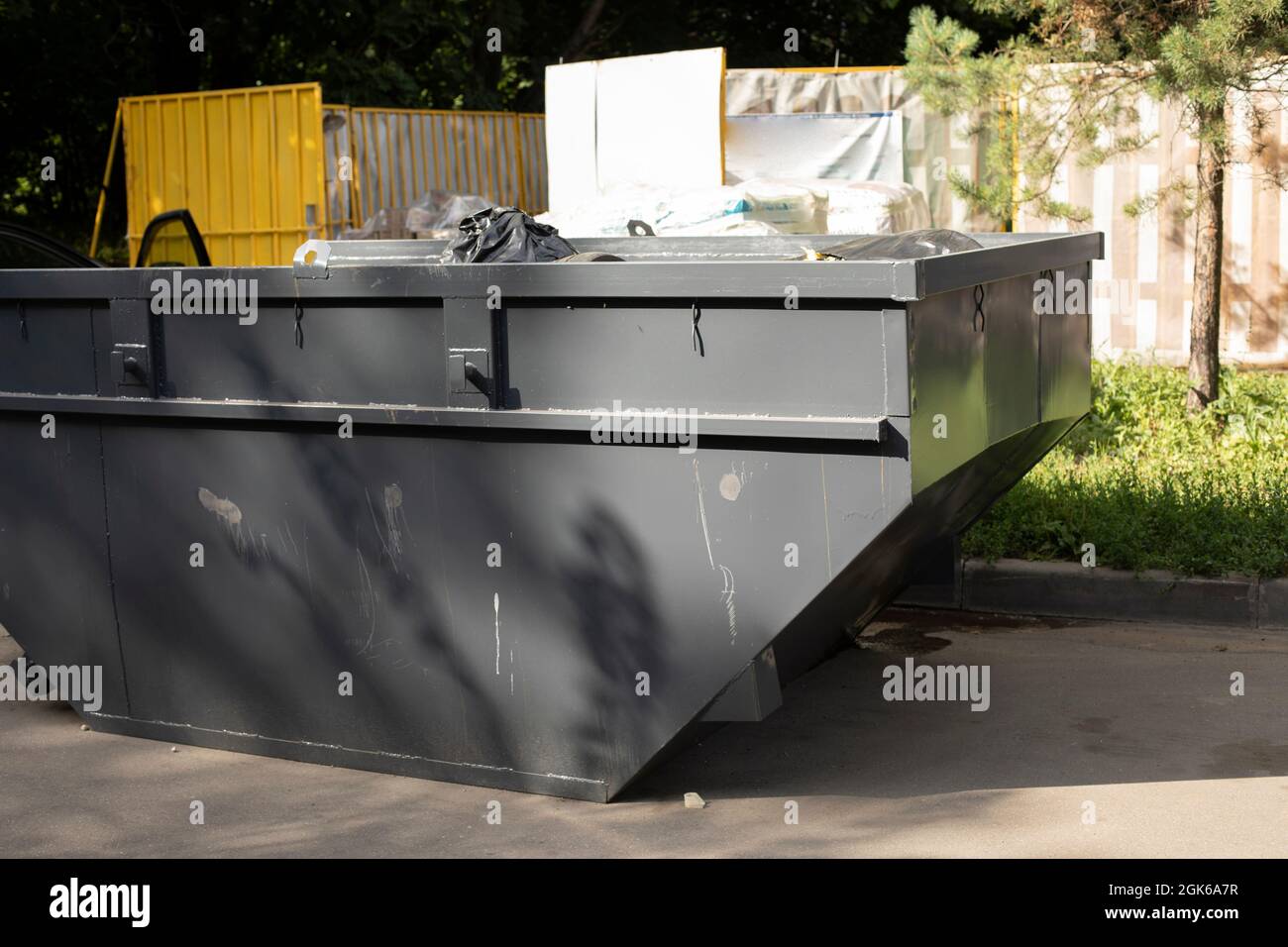 Waste bin for large waste. Trash container on the street. Gray painted