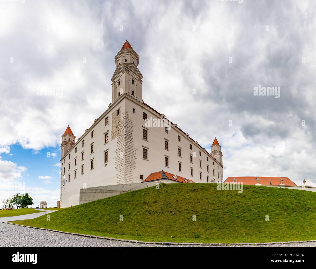 A panorama picture of the Bratislava Castle and its lawn. Stock Photo