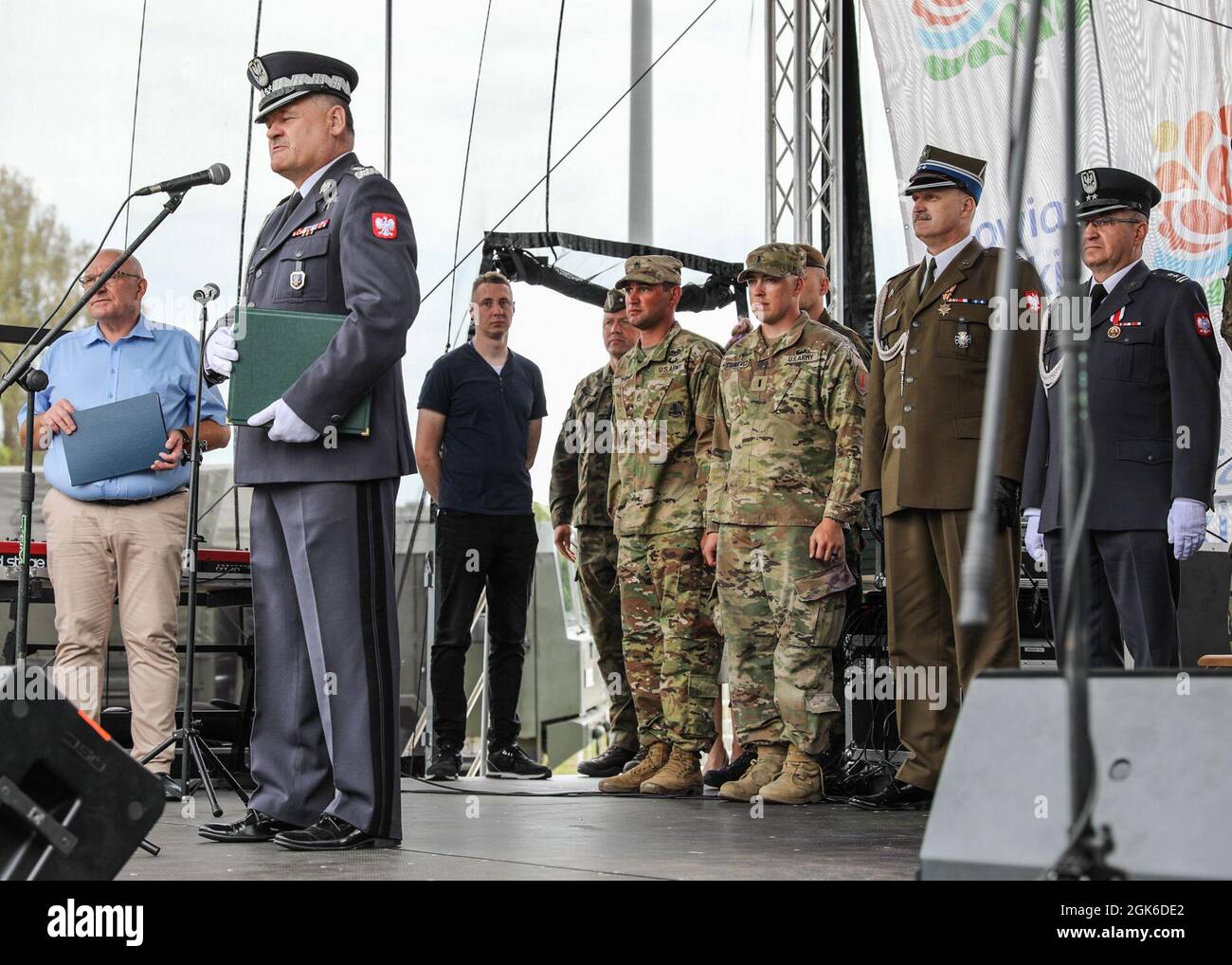 Soldiers from 2nd Battalion, 34th Armored Regiment, 1st Armored Brigade Combat Team, 1st Infantry Division, receive recognition from Polish Armed Forces leadership during a Polish Armed Forces Day event in Pila, Poland, August 14, 2021. The day celebrates when the Polish Army successfully repulsed a Red Army offensive outside of Warsaw in mid-August 1920. The 1st Infantry Division's presence in Poland during Atlantic Resolve contributes to security in the region, providing deterrence and strengthening the Alliance, and that by enhancing that presence, we will continue to ensure democracy, free Stock Photo