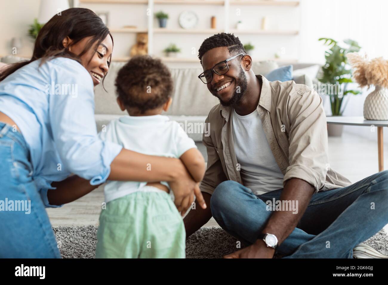 Portrait of happy black family smiling playing at home Stock Photo - Alamy