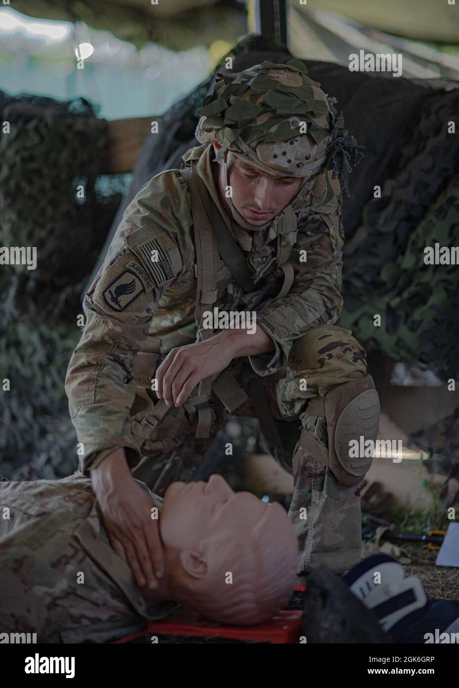 A U.S. Army paratrooper assigned to the 173rd Airborne Brigade completes a medical task during the Expert Infantryman Badge (EIB) testing on August, 15 2021 at Caserma Del Din, Italy. Earning the coveted Expert Infantryman Badge (EIB) / Expert Soldier Badge (ESB) displays Soldiers' proficiency in their specialty and sets them apart from their peers.    The 173rd Airborne Brigade is the U.S. Army’s Contingency Response Force in Europe, providing rapidly deployable forces to the United States European, Africa and Central Command areas of responsibility. Forward deployable across Italy and German Stock Photo