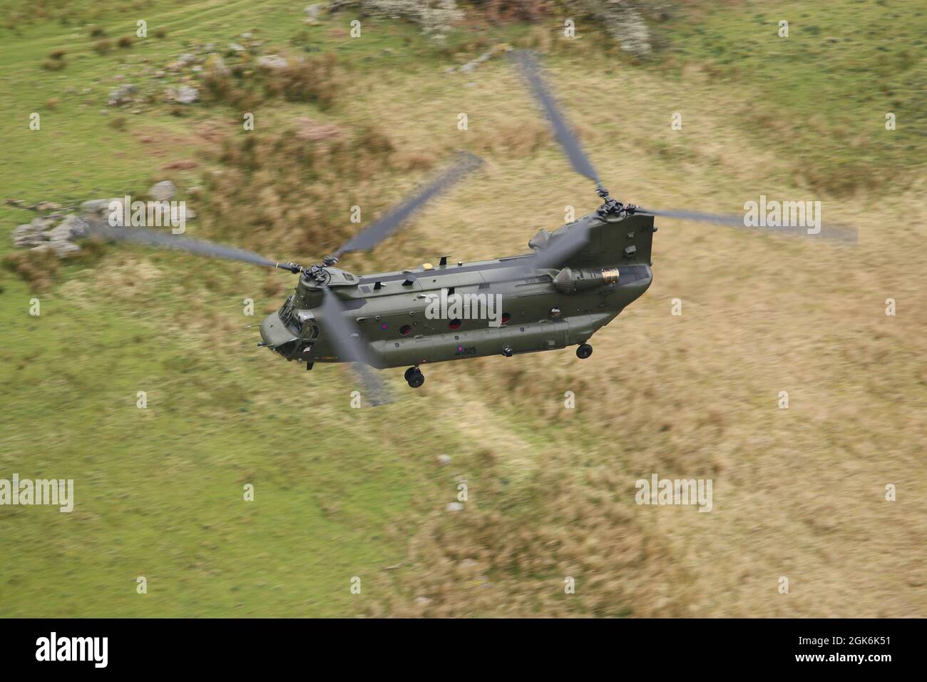 RAF Chinook helicopter, serial number ZA680, flying low level in the 'mach loop' area of Wales, United kingdom. Stock Photo