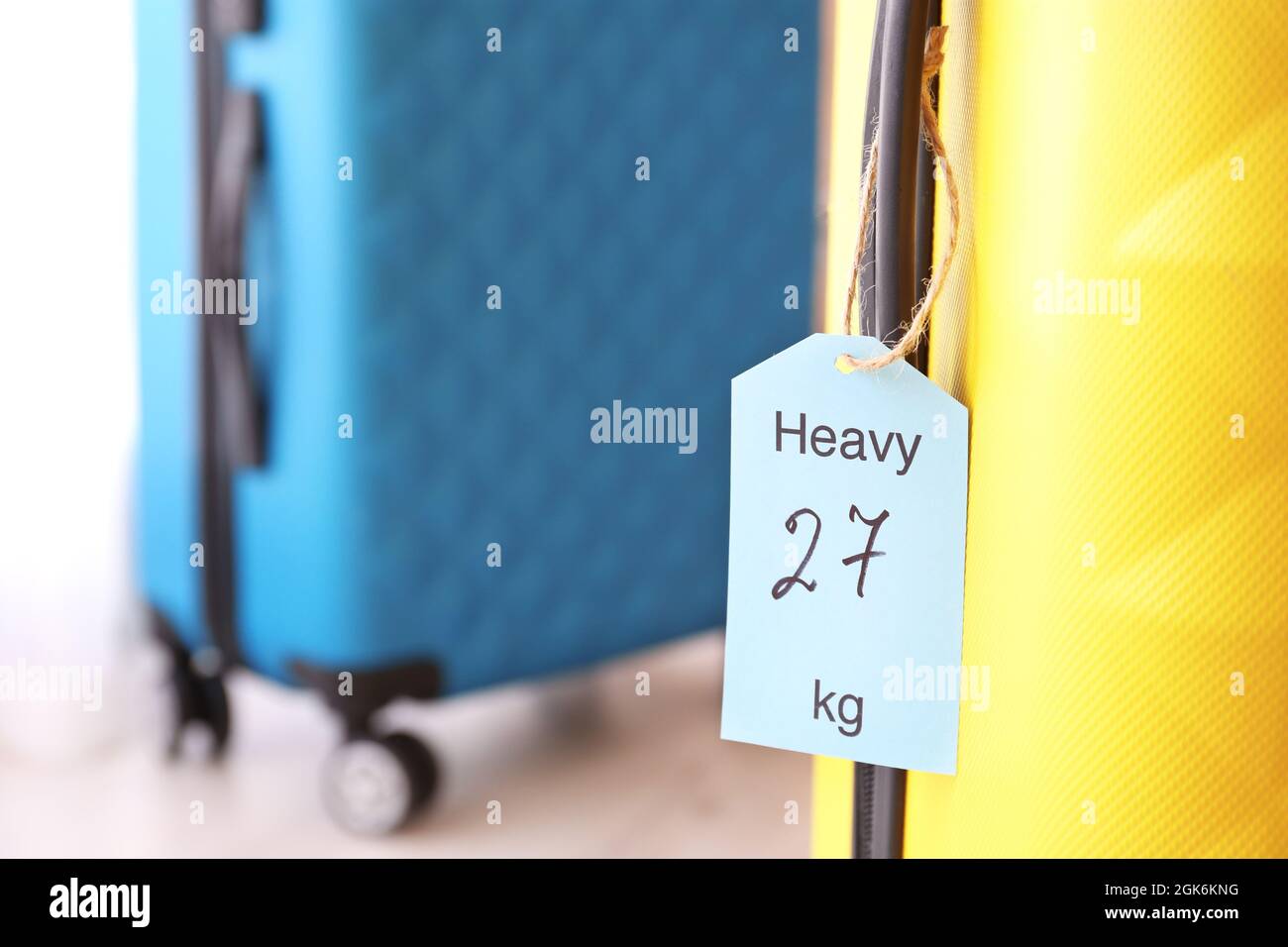 Tag on heavy suitcase. Luggage overweight concept Stock Photo Alamy