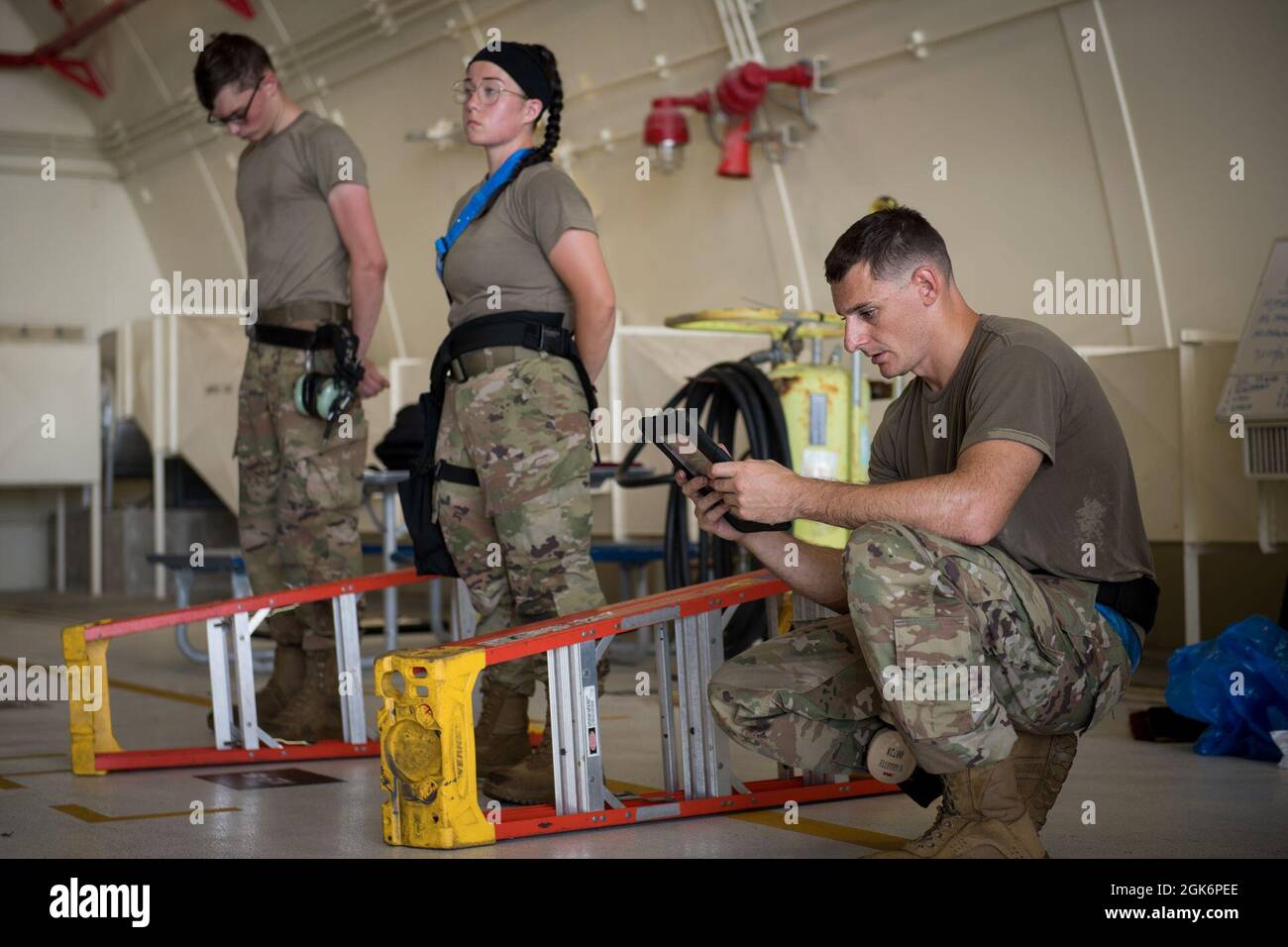 U.S. Air Force Airmen from the 44th Aircraft Maintenance Unit wait for ...
