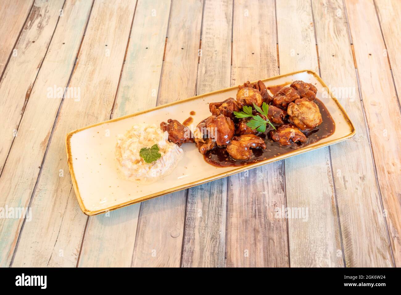 Tray of boneless wings stewed with barbecue sauce and a little Russian