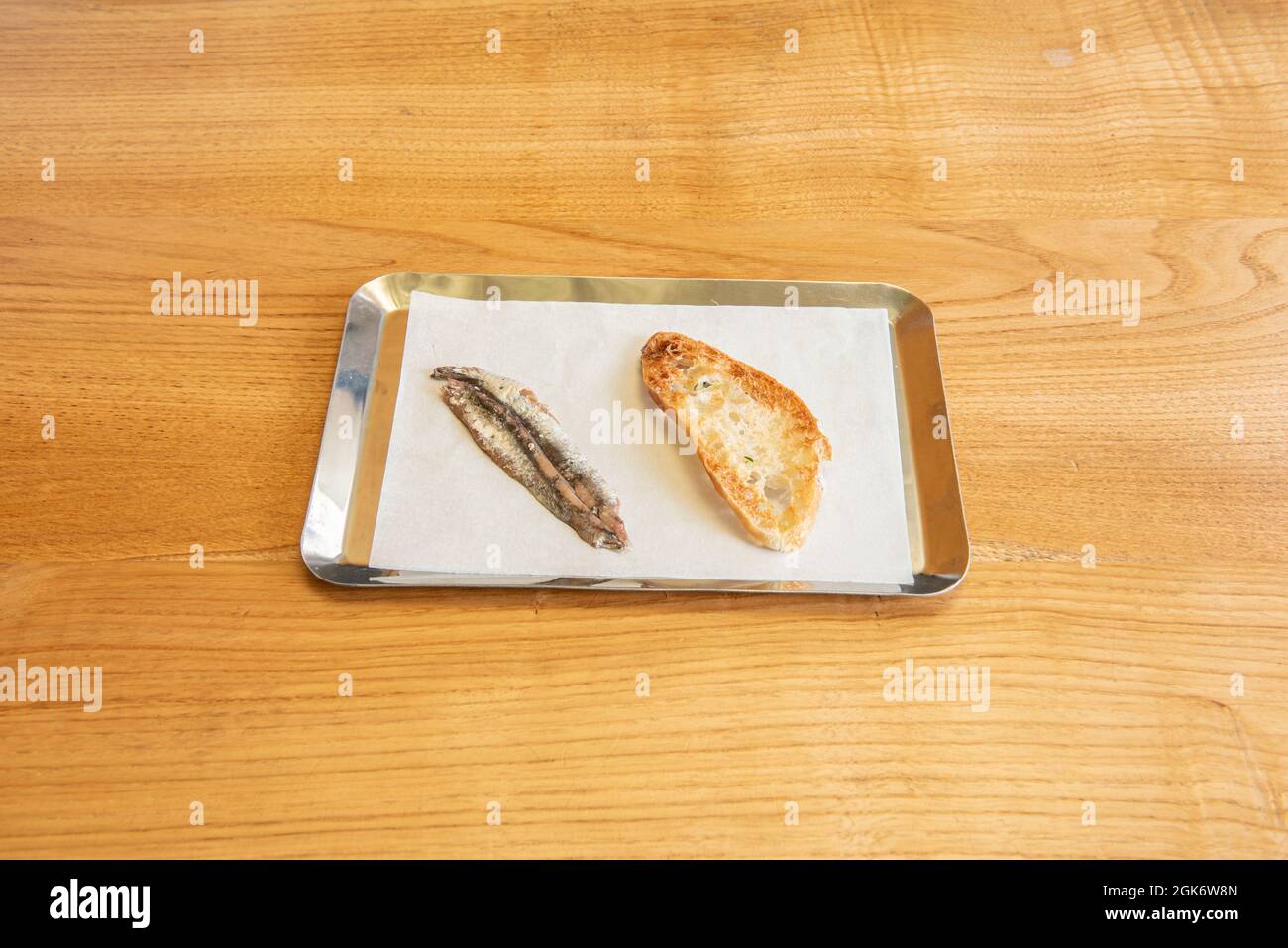Delicious Spanish Cantabrian anchovy tapa by toast bread on