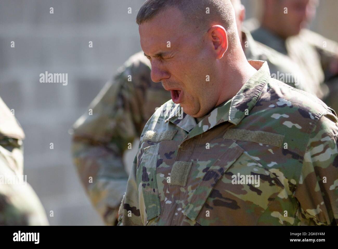 A Soldier assigned to the 447th Military Police Company recuperates from the effects of the CBRN chamber during training as part of a Mobilization Exercise, Aug. 19, 2021 at Camp Shelby, MS. Stock Photo