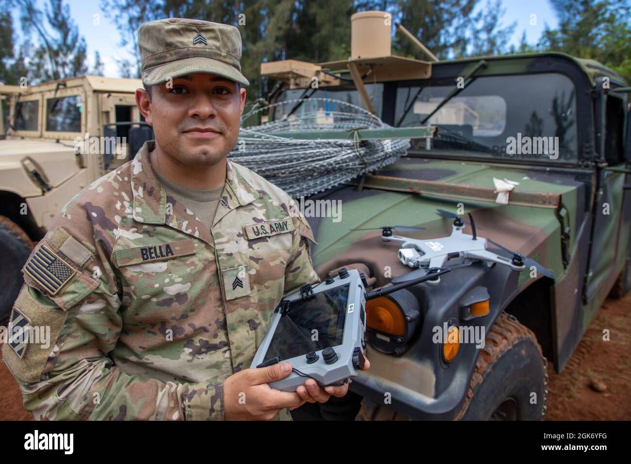 sgt-timothy-bella-a-geospatial-engineer-assigned-to-3rd-infantry-brigade-combat-team-25th-infantry-division-poses-with-a-golden-eagle-drone-during-exercise-bronco-rumble-at-the-kahuku-training-area-hawaii