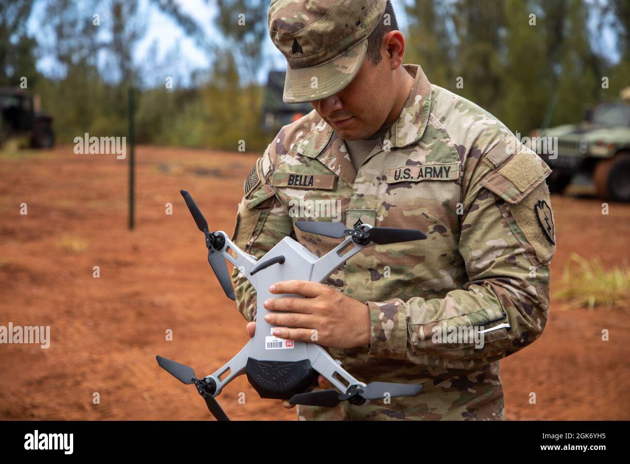 Sgt. Timothy Bella, a geospatial engineer assigned to 3rd Infantry Brigade  Combat Team, 25th Infantry Division, prepares a Golden Eagle drone for  flight during Exercise Bronco Rumble at the Kahuku Training Area,