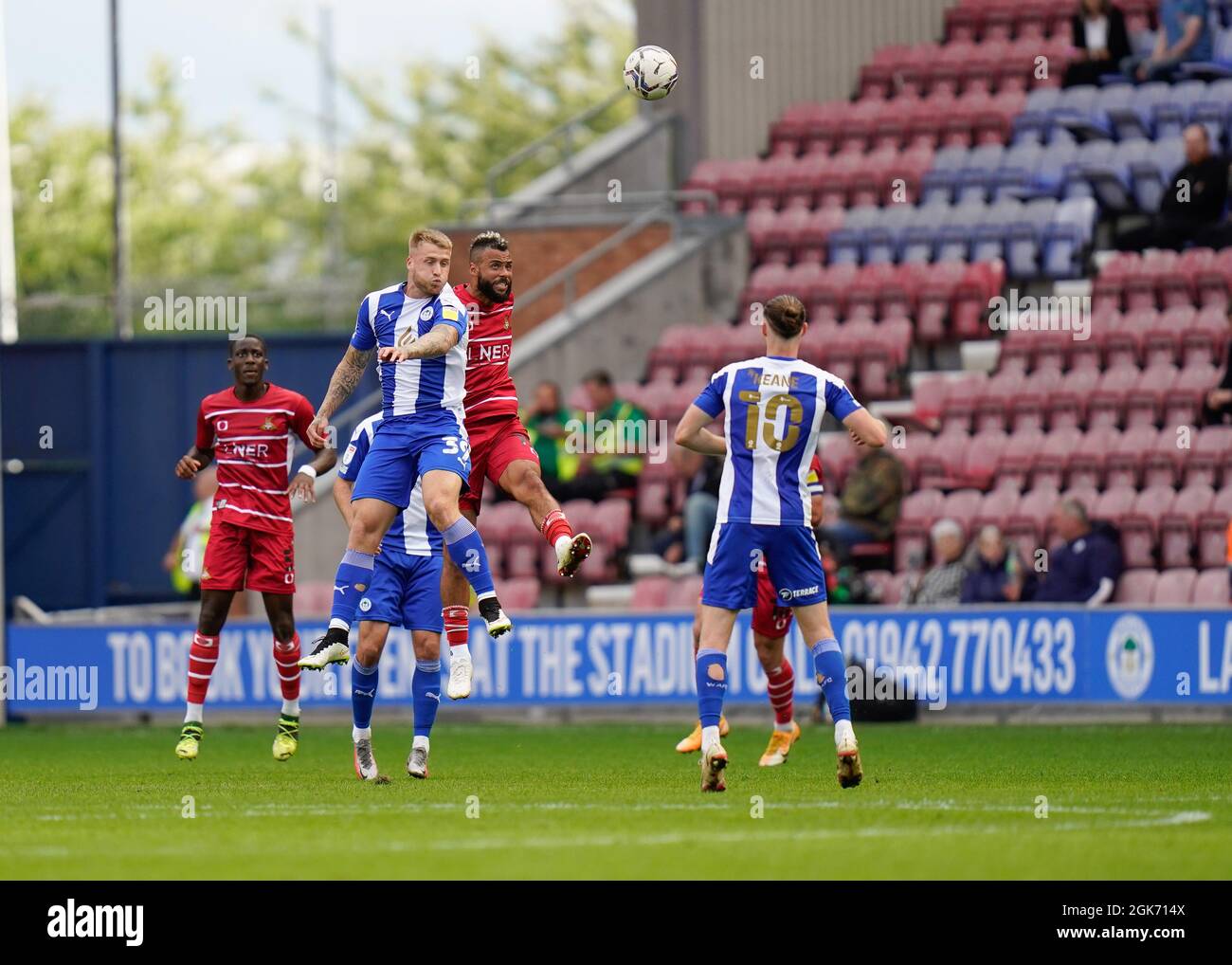 Doncaster's John Bostock competes for a header with Wigan’s Stephen Humphrys Picture by Steve Flynn/AHPIX.com, Football:  match Wigan Athletic -V- Don Stock Photo