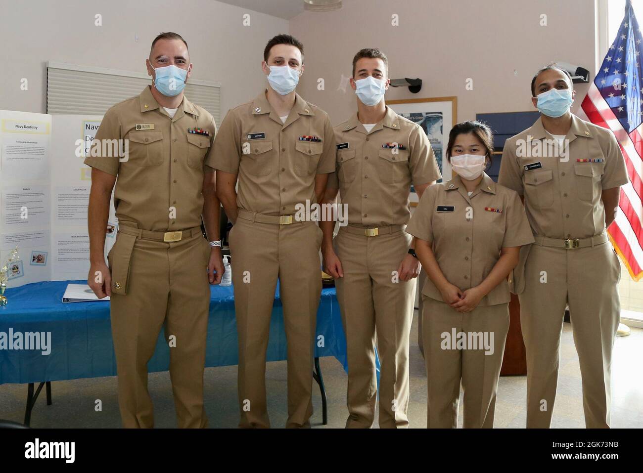 Navy Dental Corps Officers assigned to Navy Medicine Readiness and Training Command Lemoore celebrated the U.S. Navy Dental Corps 109th Birthday cake during a small ceremony held at Naval Health Clinic Lemoore. From left to right:Lt. Cmdr. Andrew Knudson, Lt. Ronald Layton III, Lt. Kyle Birchall , Lt. Sojeong Kim, Lt. Cmdr. Raghav Khandelwal. Stock Photo