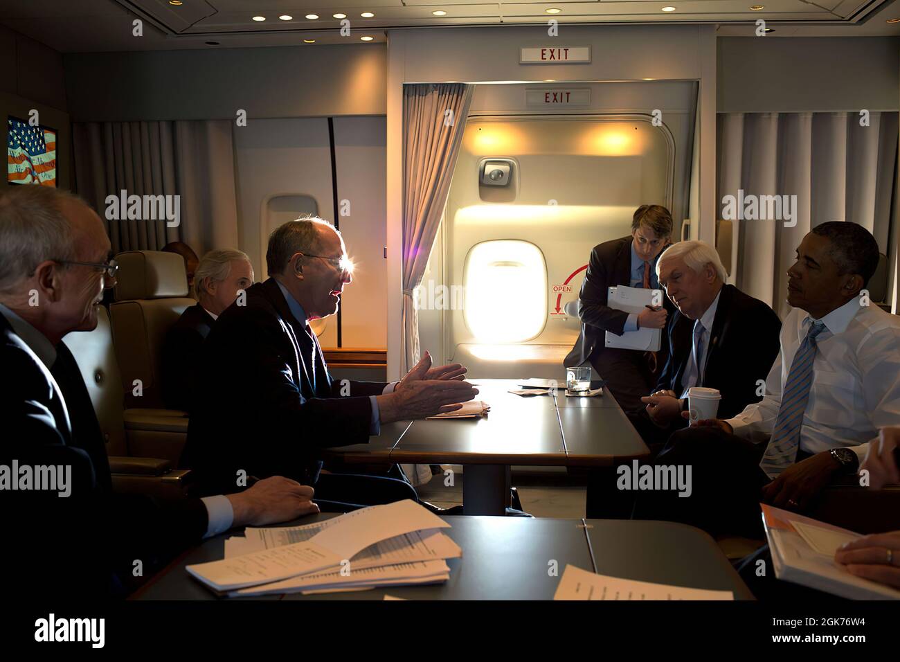 President Barack Obama listens to Sen. Lamar Alexander, R-Tenn. while meeting with a congressional delegation aboard Air Force One en route to Knoxville, Tenn., Jan. 9, 2015. Also attending, left to right, Ted Mitchell, Undersecretary of Education; Sen. Bob Corker, R-Tenn; James Kvaal, Deputy Director of the Domestic Policy Council and Rep. John 'Jimmy' Duncan, R-Tenn. (Official White House Photo by Pete Souza) This official White House photograph is being made available only for publication by news organizations and/or for personal use printing by the subject(s) of the photograph. The photogr Stock Photo