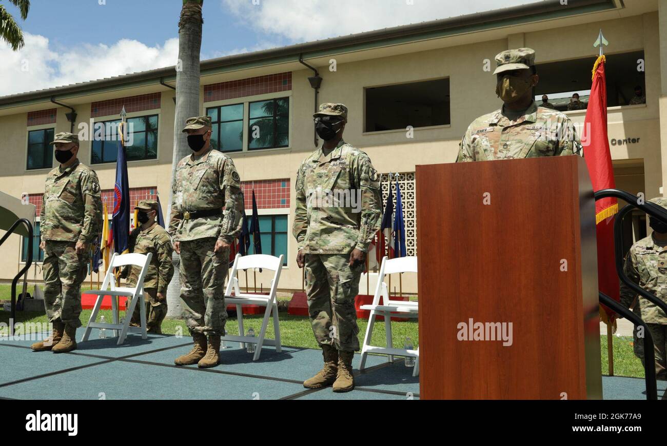 U.S. Army Reserve soldiers of the 9th Mission Support Command stand at attention on August 22 2021, at Fort Shafter Flats in Honolulu.  The 'passing of the colors', where the guidon is passed from the outgoing commander to the new, is a tradition used to symbolize the the change of command. Stock Photo