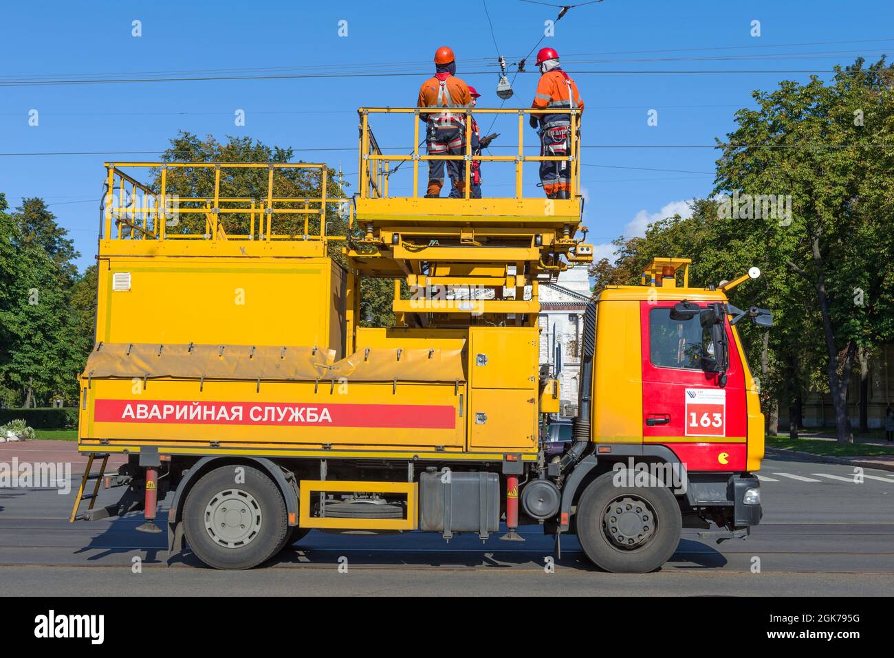 SAINT PETERSBURG, RUSSIA - SEPTEMBER 05, 2021: City electric transport emergency service vehicle with workers on the elimination of the accident of th Stock Photo