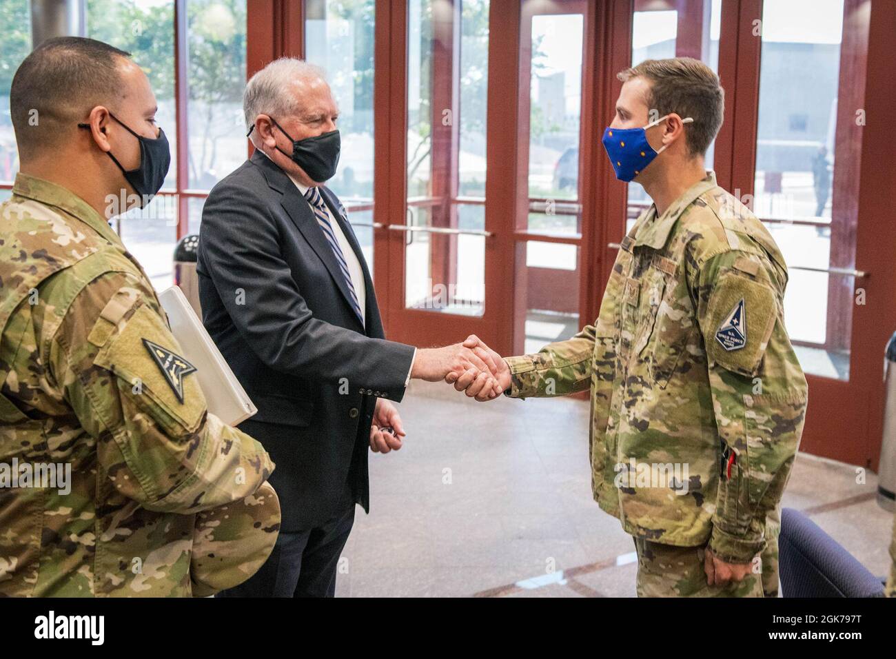 Secretary of the Air Force Frank Kendall gives a challenge coin to U.S ...