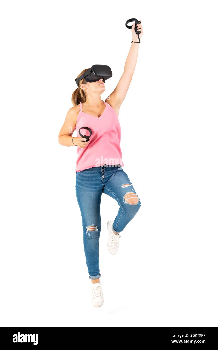 Young woman playing with a VR glasses on a white background Stock Photo