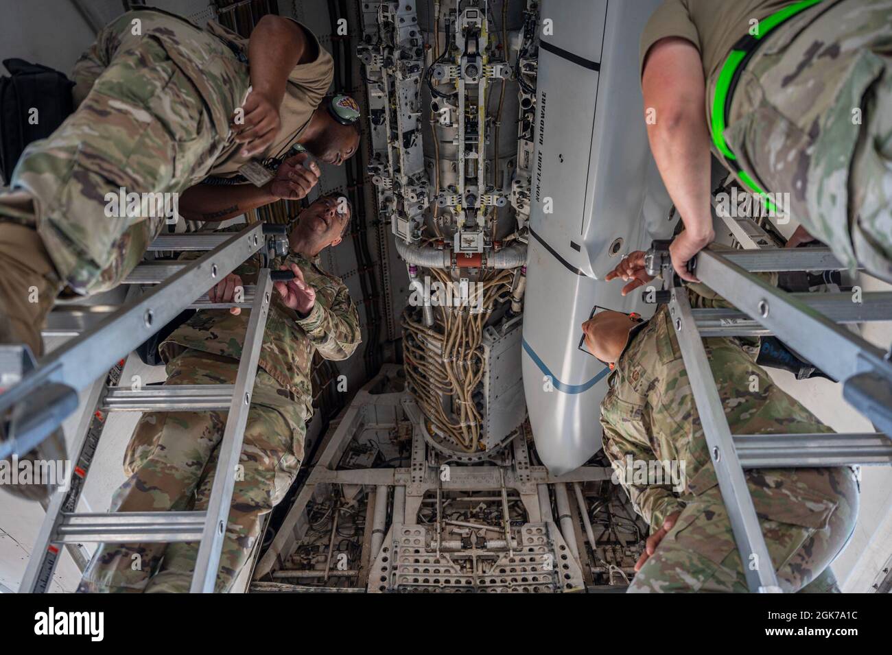 Maj. Gen. Andrew Gebara, 8th Air Force and Joint-Global Strike Operations Center commander, center left, and Chief Master Sgt. Melvina Smith, 8th AF command chief, center right, watch as Airmen assigned to the 7th Aircraft Maintenance Squadron load inert munitions into a B-1B Lancer during a weapons load exercise at Dyess Air Force Base, Texas, Aug. 23, 2021. The B-1 is a long-range strategic bomber capable of delivering precision and non-precision munitions to any location around the globe. Stock Photo