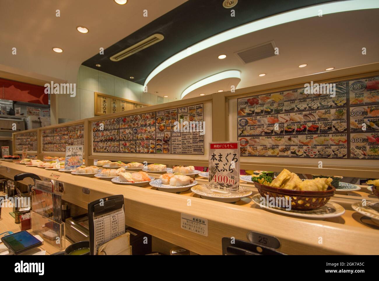 Sushi conveyor belt stocked with various types, Osaka, Japan Stock Photo