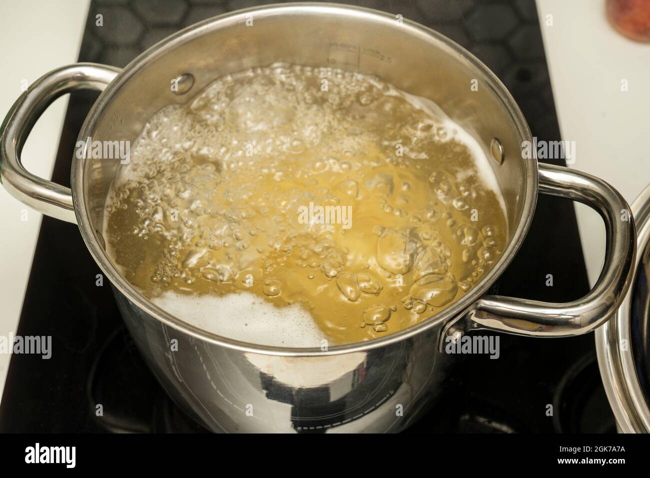 Stainless steel pot with boiling water Stock Photo Alamy