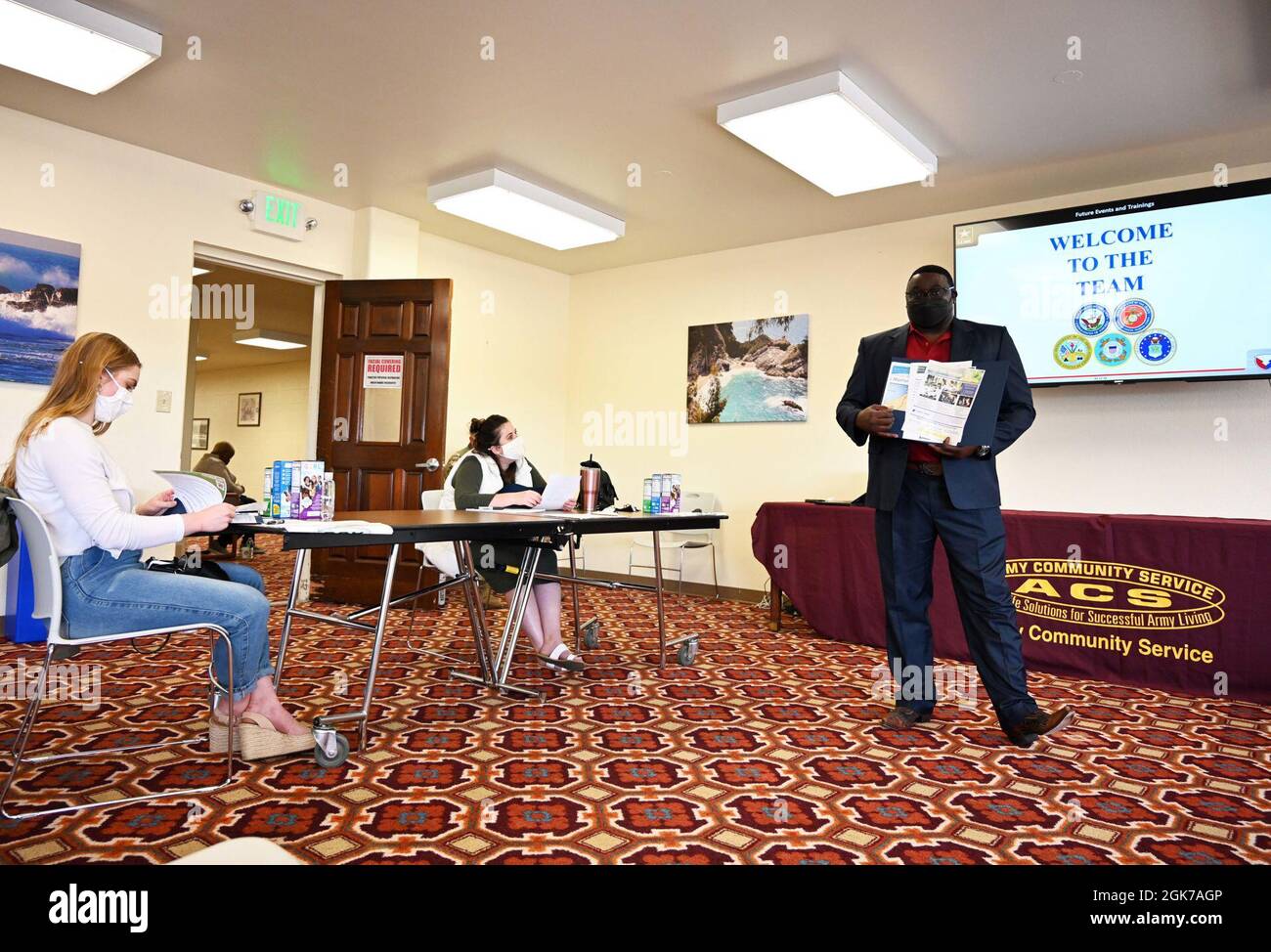 Charles Lyons, program specialist for Army Community Service and Presidio of Monterey Military Spouse Orientation organizer, speaks during the Presidio of Monterey Military Spouse Orientation at the General Stilwell Community Center, Ord Military Community, Calif., Aug. 23. Stock Photo