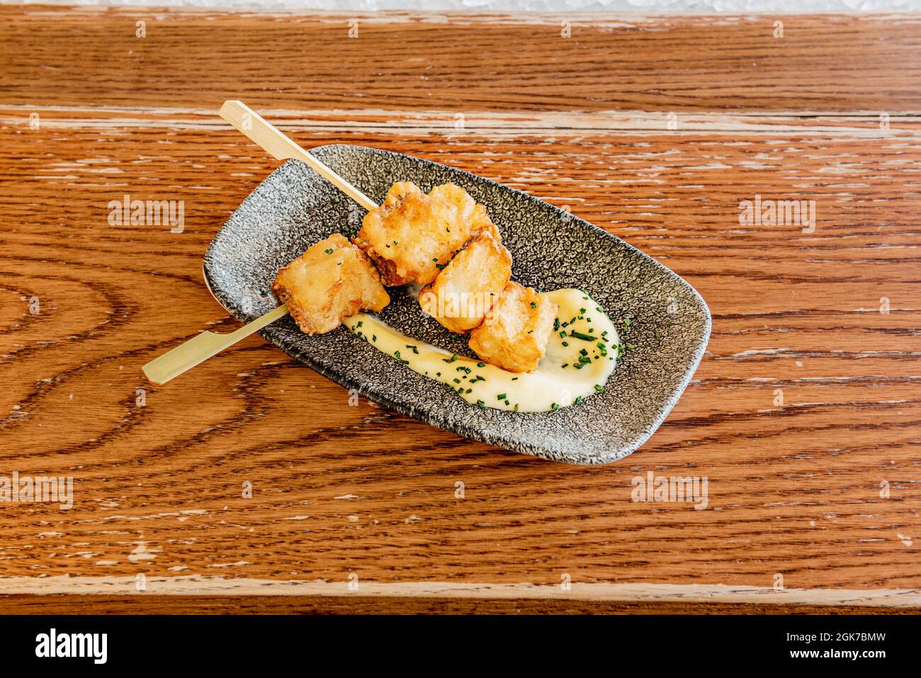 cod taco skewers in tempura with aioli sauce Stock Photo Alamy