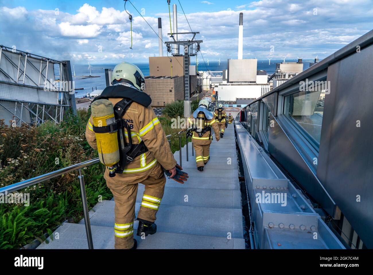 CopenHill, waste incinerator and artificial ski slope, firefighters do, under breathing protection, endurance training, skiing overlooking ski lift, 9 Stock Photo