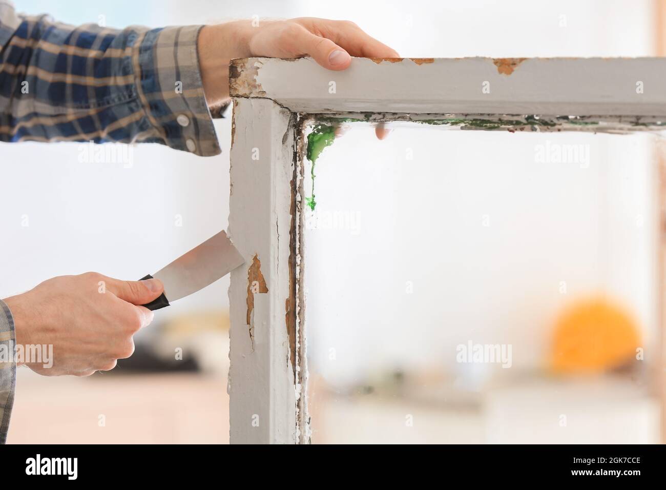 Worker removing paint from old window frame, closeup Stock Photo Alamy