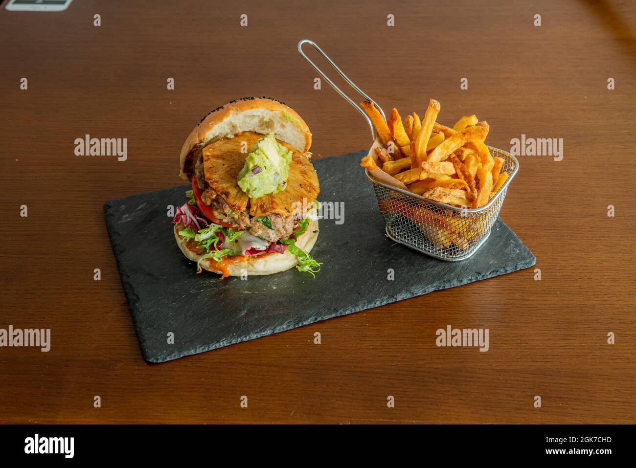 Grilled Pineapple Slice Veal Burger with Guacamole and Melted Cheddar